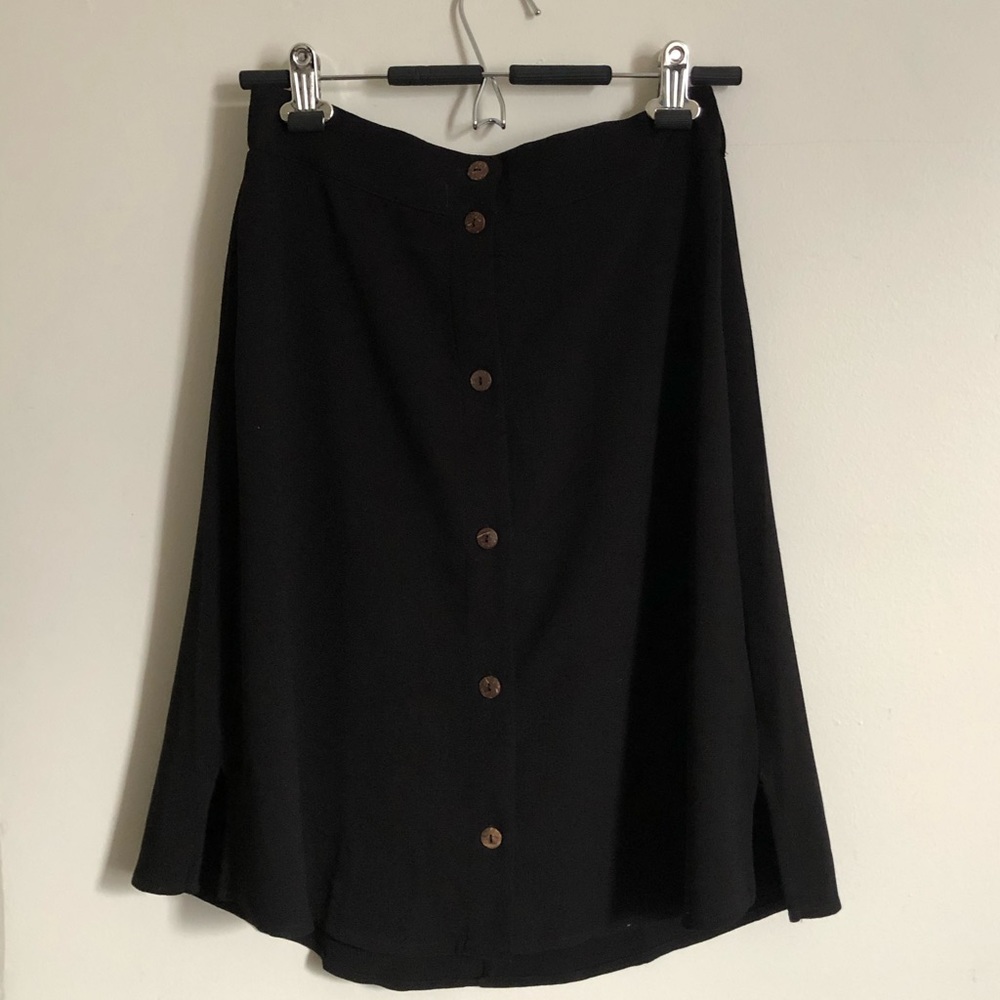 Knee length black skirt with buttons